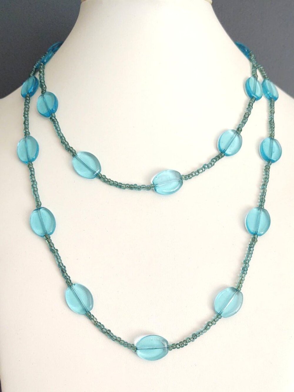 Long single strand blue seed bead and glass bead necklace